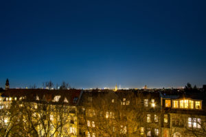 Berlin, street with illuminated windows, corona pandemic, curfew, everyone is at home, sky without planes Berlin, street with illuminated windows, corona pandemic, curfew, everyone is at home, sky without planes